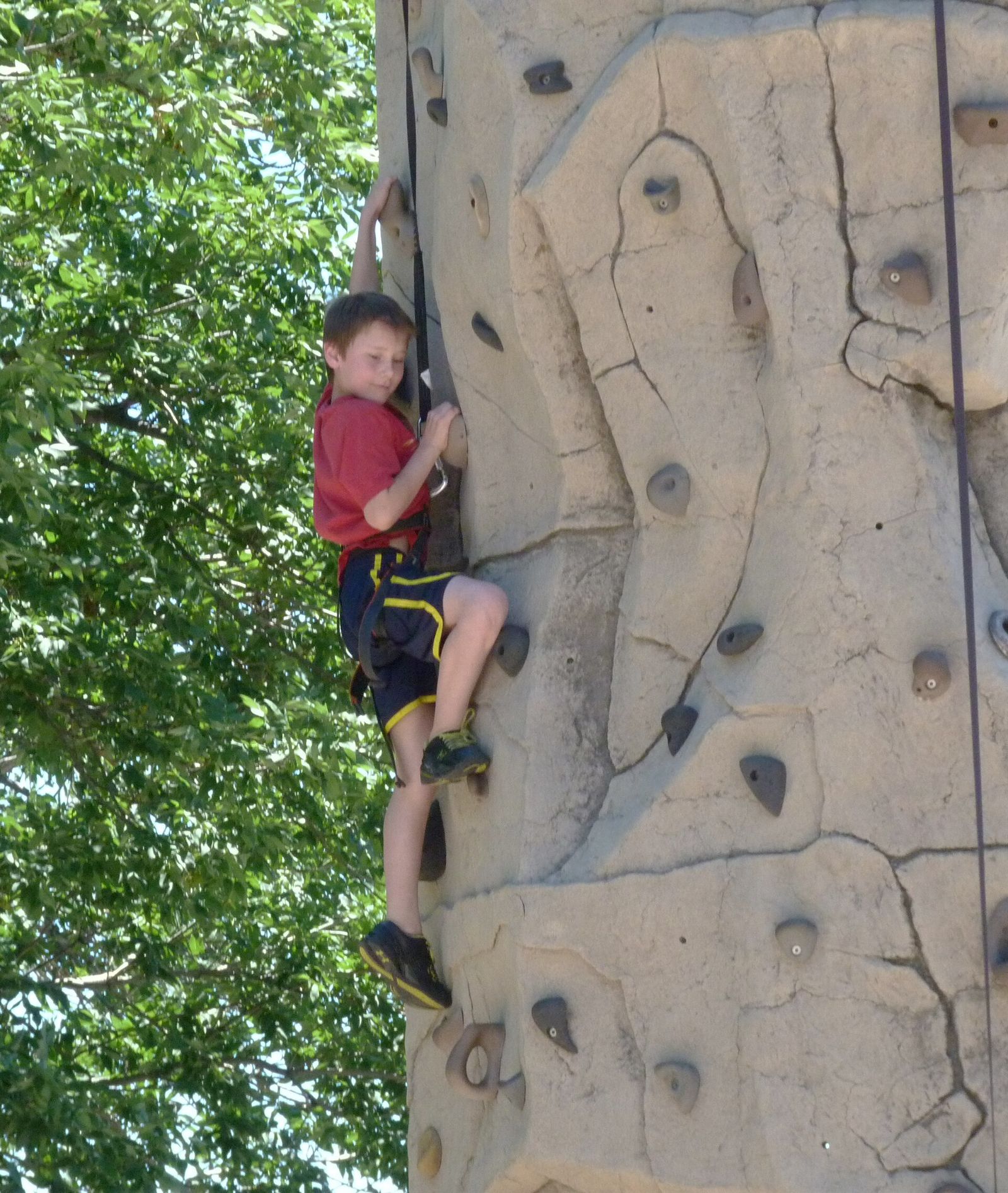 A climber on an outdoor rock face