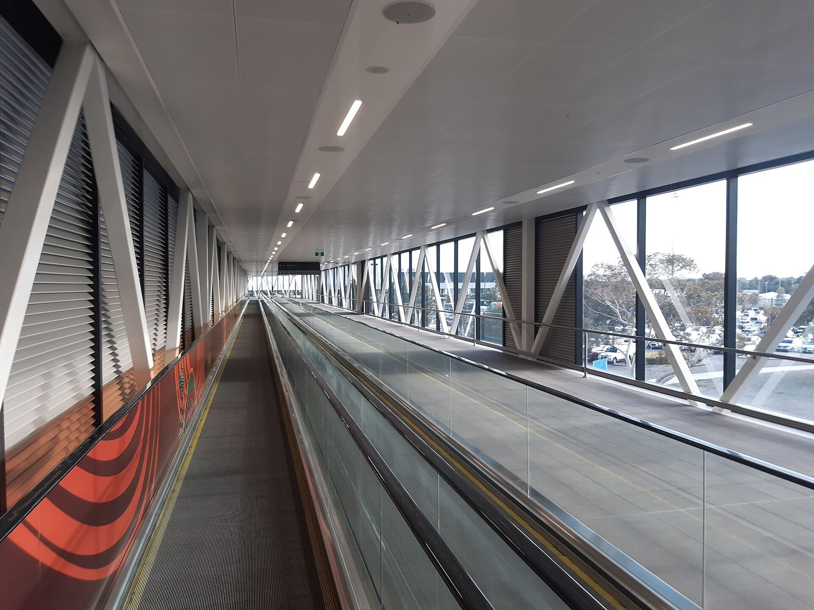A long walkway inside an airport terminal