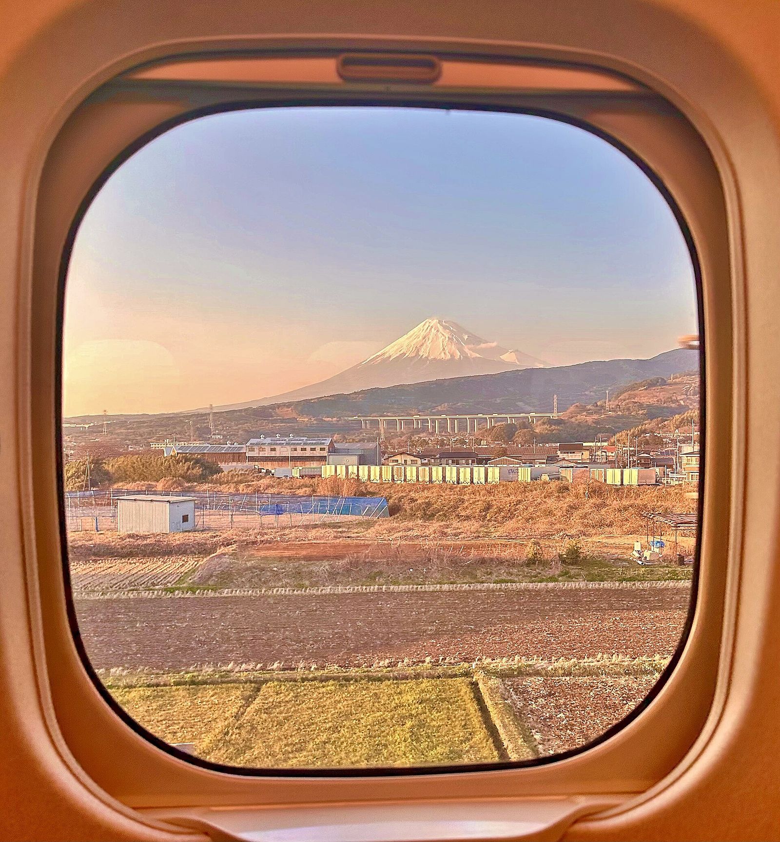 A Shinkansen train passing Mount Fuji