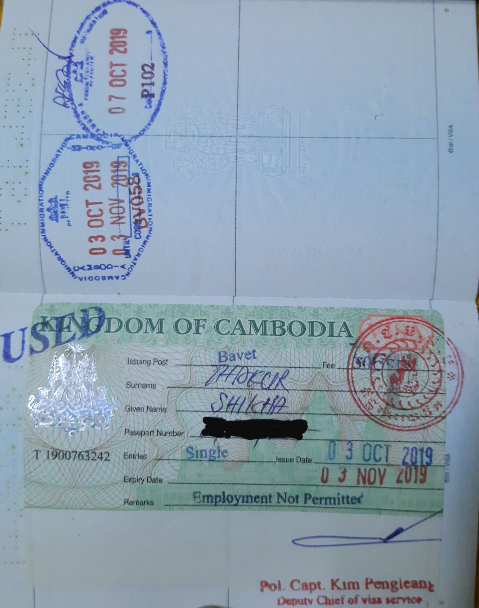 Visa stamps across the pages of a passport