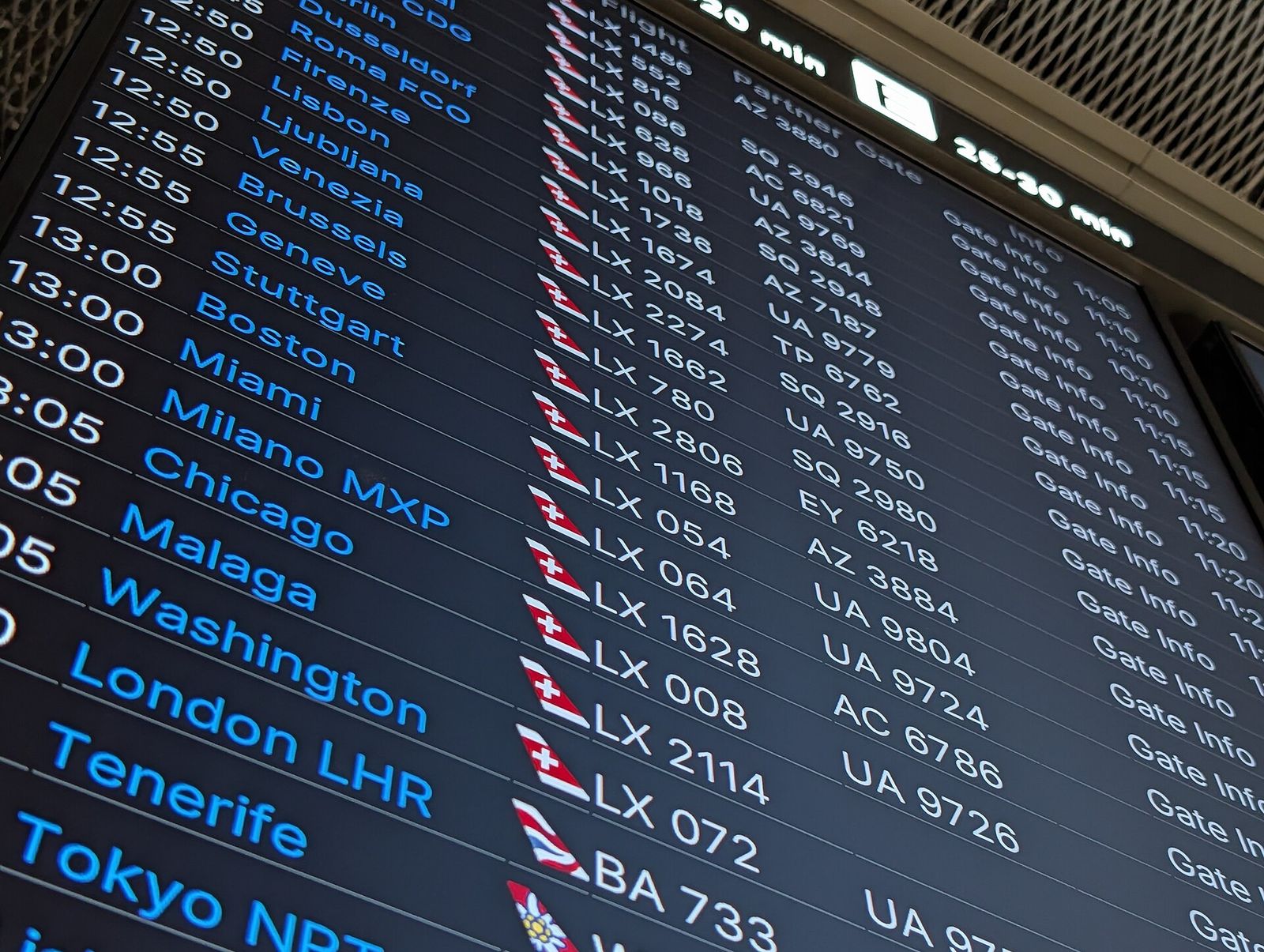 A departure board showing changed flight information